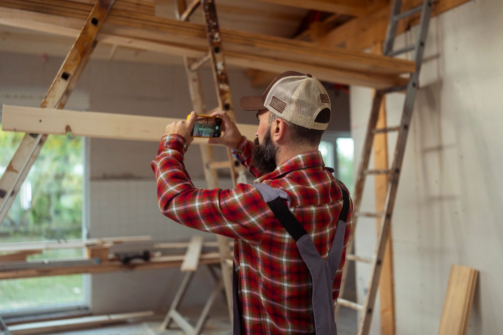 Contractor documenting renovation work for project updates